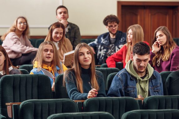 group-cheerful-students-sitting-lecture-hall-before-lesson.jpg